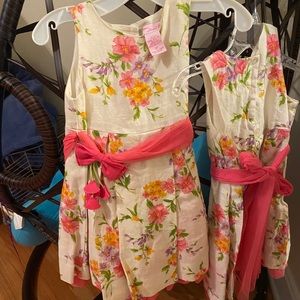 two children’s floral dress made by Anna’s Garden